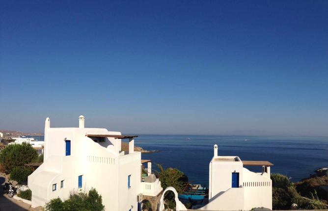 Traditional yet deluxe Cycladic white houses by the sea | Courtesy of Mykonos Mystique