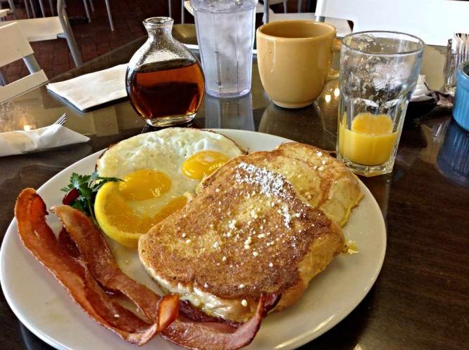 A southern comfort style breakfast with sweet and savory items.