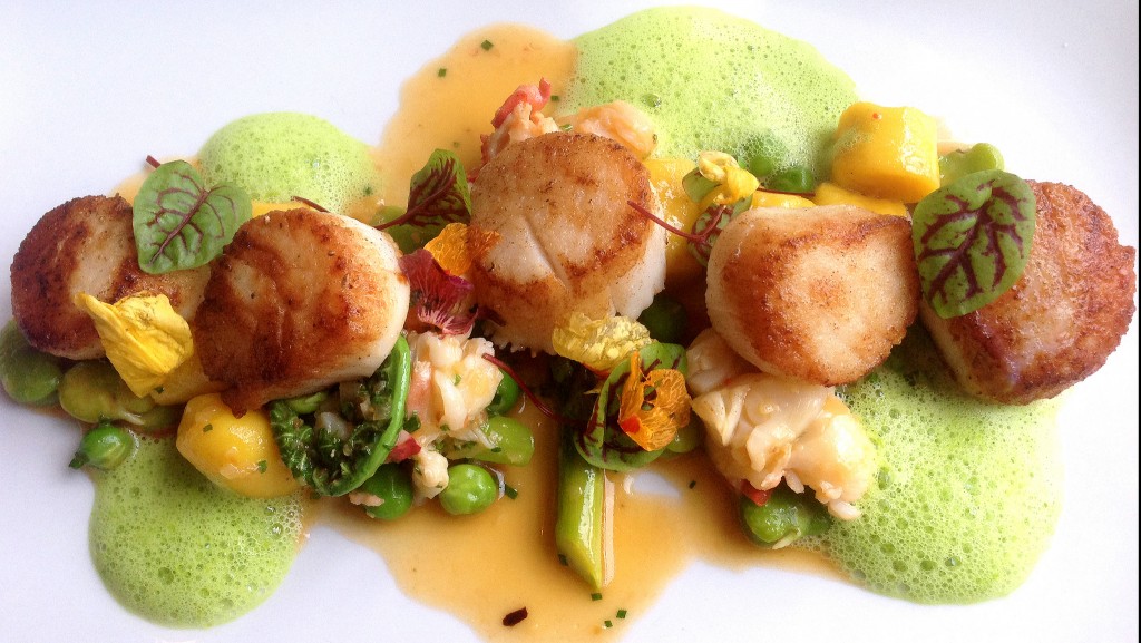 Seared day boat scallops with saffron gnocchi, poached lobster, and early Spring vegetables at Troquet | ©Dale Cruse/Flickr