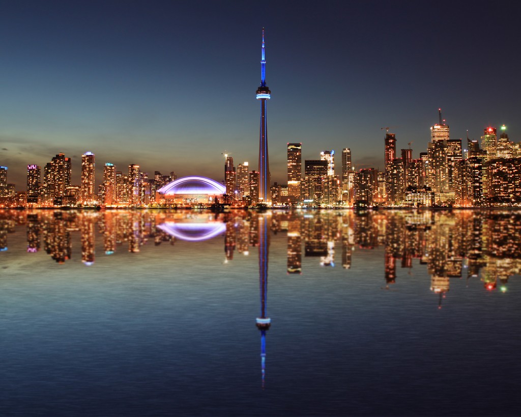 CN Tower - Toronto Skyline at night with a reflection in Lake Ontario © Inga Locmele / Shutterstock