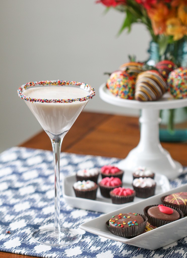 birthday cake martini with sprinkles in a glass and chocolate covered Oreo cookies and dipped strawberries and mini cupcakes | © Shari's Berries/Flickr