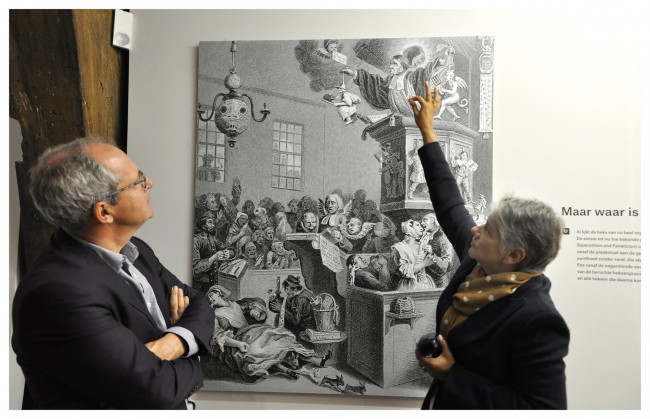 Guest curator Dr. Renilde Vervoort shows the first known depiction of the witch's pointy hat | © Sarah Bauwens