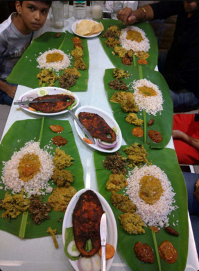Table of food at Fountain Plaza, Fort. Image Courtesy: Zomato