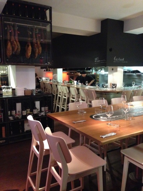 The wide wooden table with tapas running through makes up the perfect dinner decor for a group of friends | Courtesy of Comocomo