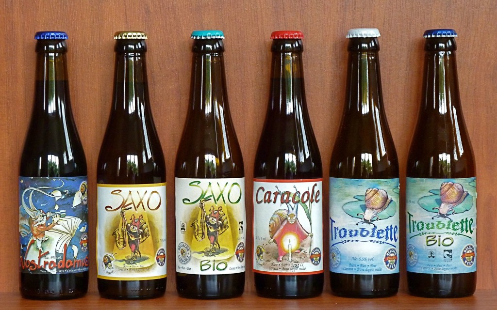 The beers of the authentic Caracole Brewery, all hand labeled with various designs featuring their signature snail mascot | Denkhenk/Wikimedia Commons