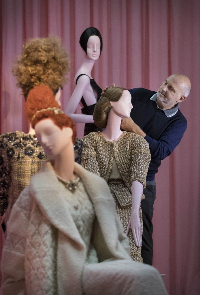 Sam McKnight puts the finishing touches to a display of mannequins highlighting his work for Chanel. Photo: Peter Macdiarmid