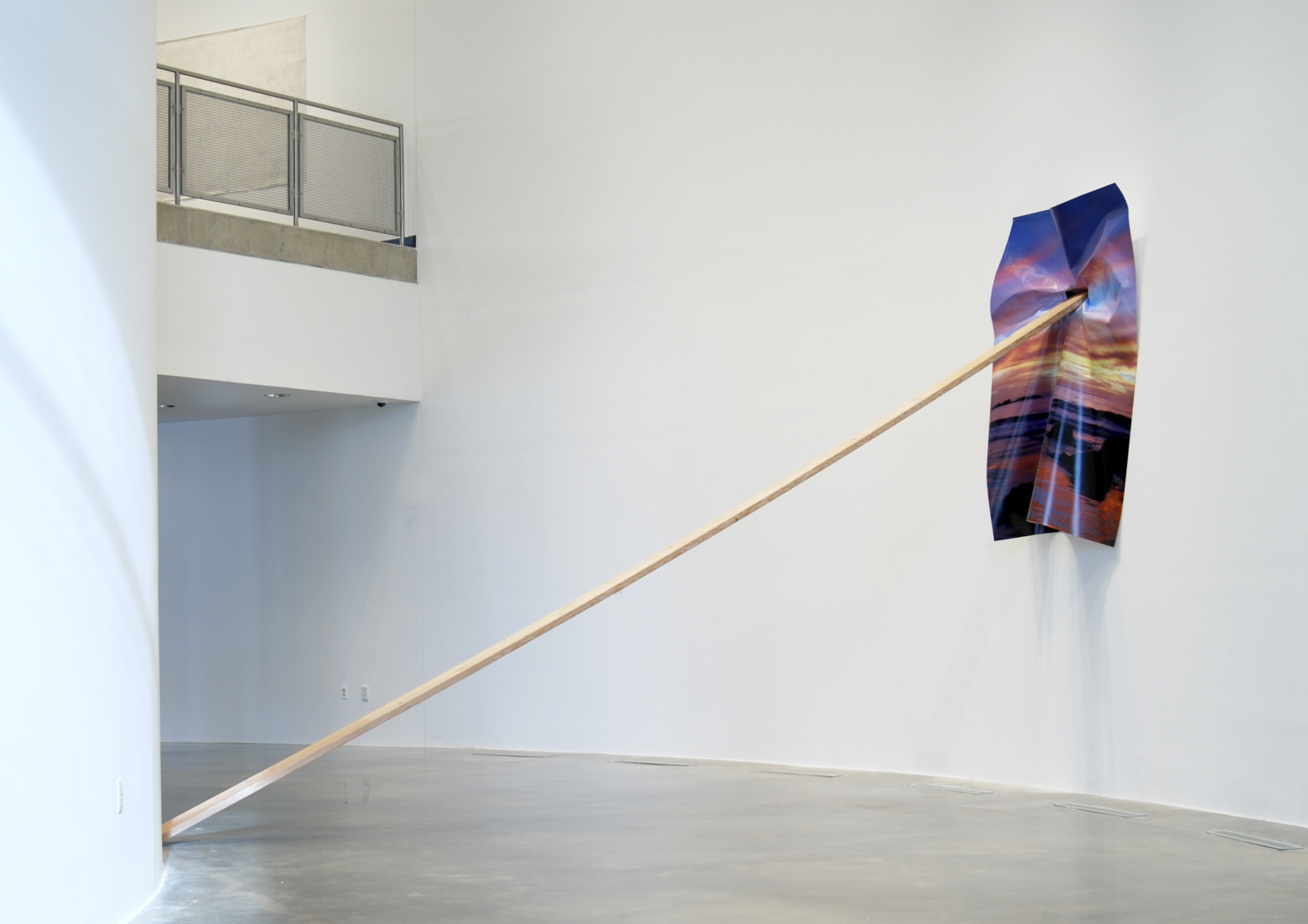 California Sunset Lean, 2014 digital print on vinyl, wood, hole in wall Installation approx 12’ x 6’ x 18’. Print size: 6’ x 8’ Installation view of Ad Infinitum, American University Museum at the Katzen Arts Center, Washington, DC. | Courtesy of Letha Wilson