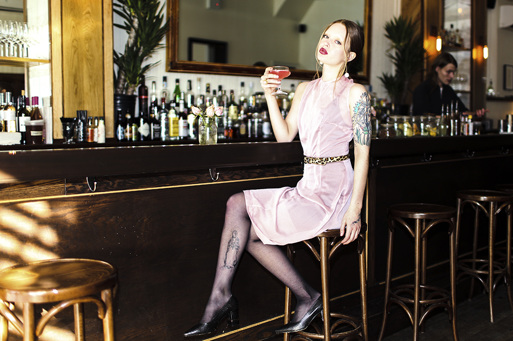 Blush Cocktail Dress MÚSED, price upon request, A. Testoni Python Pumps in black, $665. Jewelry fashion editor's own. Belt stylist's own.