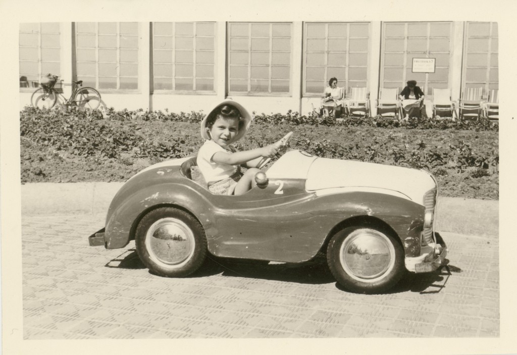 Circa 1960: Belgian kid in a toy car | jinterwasflickr