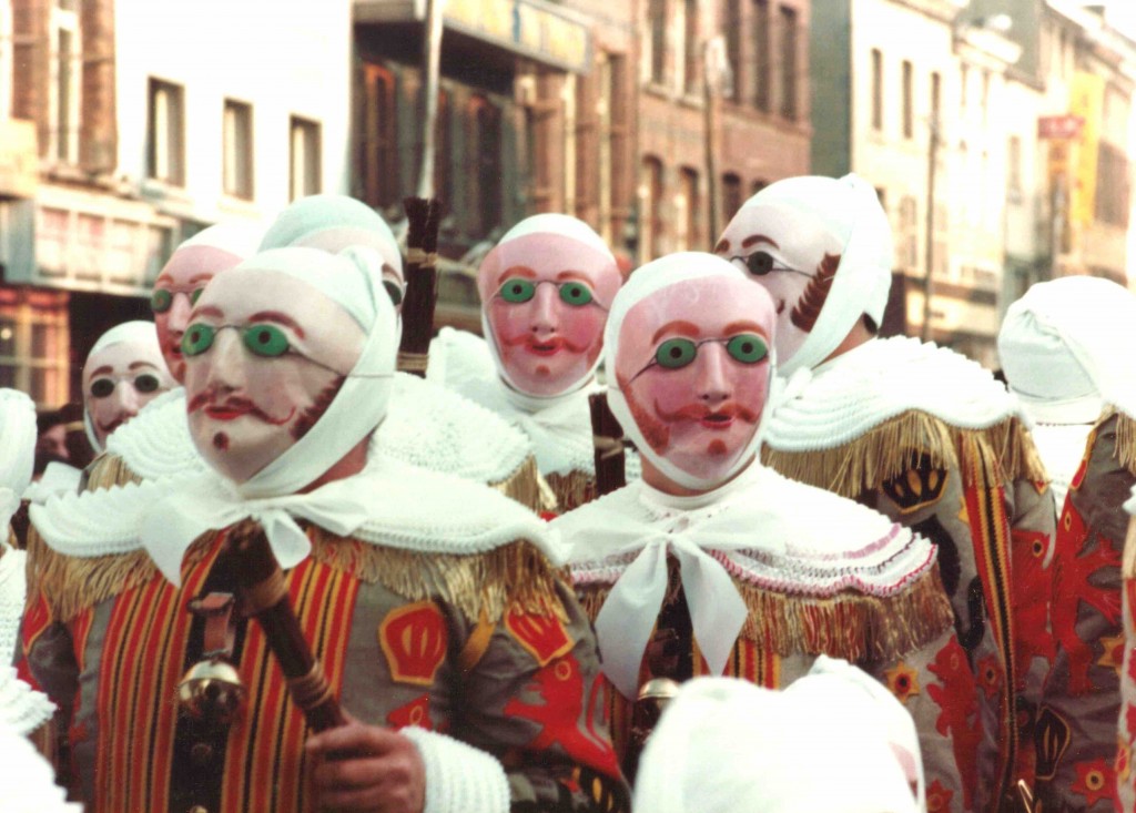 The Gilles in their wax masks with green goggles and fiery moustaches | © Marie-Claire/Wikimedia Commons