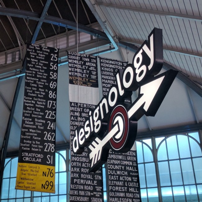 A sign hangs over the Designology exhibition at the London Transport Museum