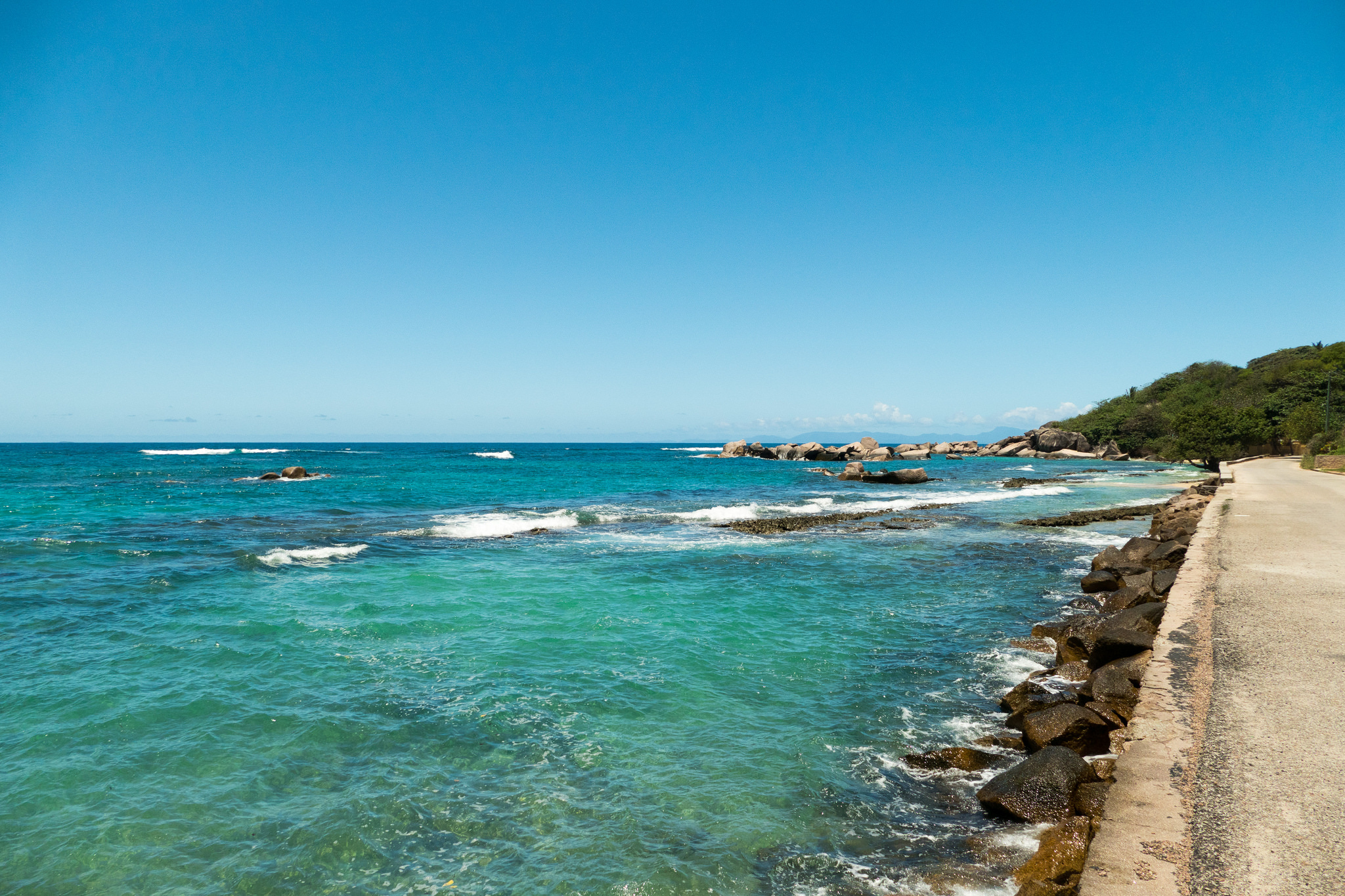 Cycle the road past Anse Consolation. | So Seychelles / Flickr