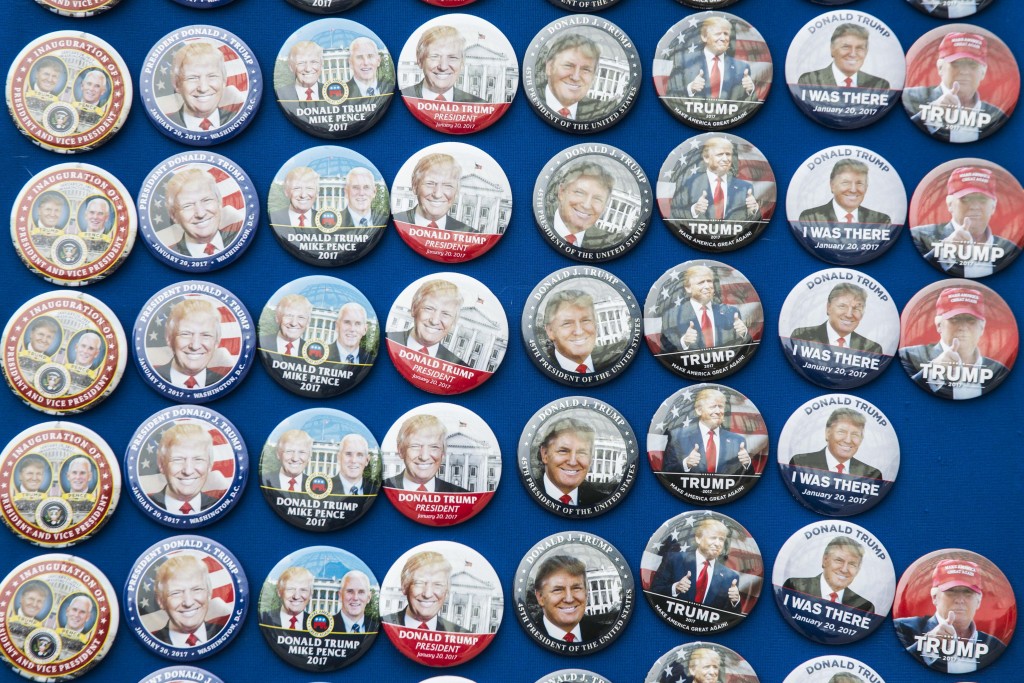 People waiting in line for entrance to the National Mall had numerous options when it came to pins | © Amanda Suarez