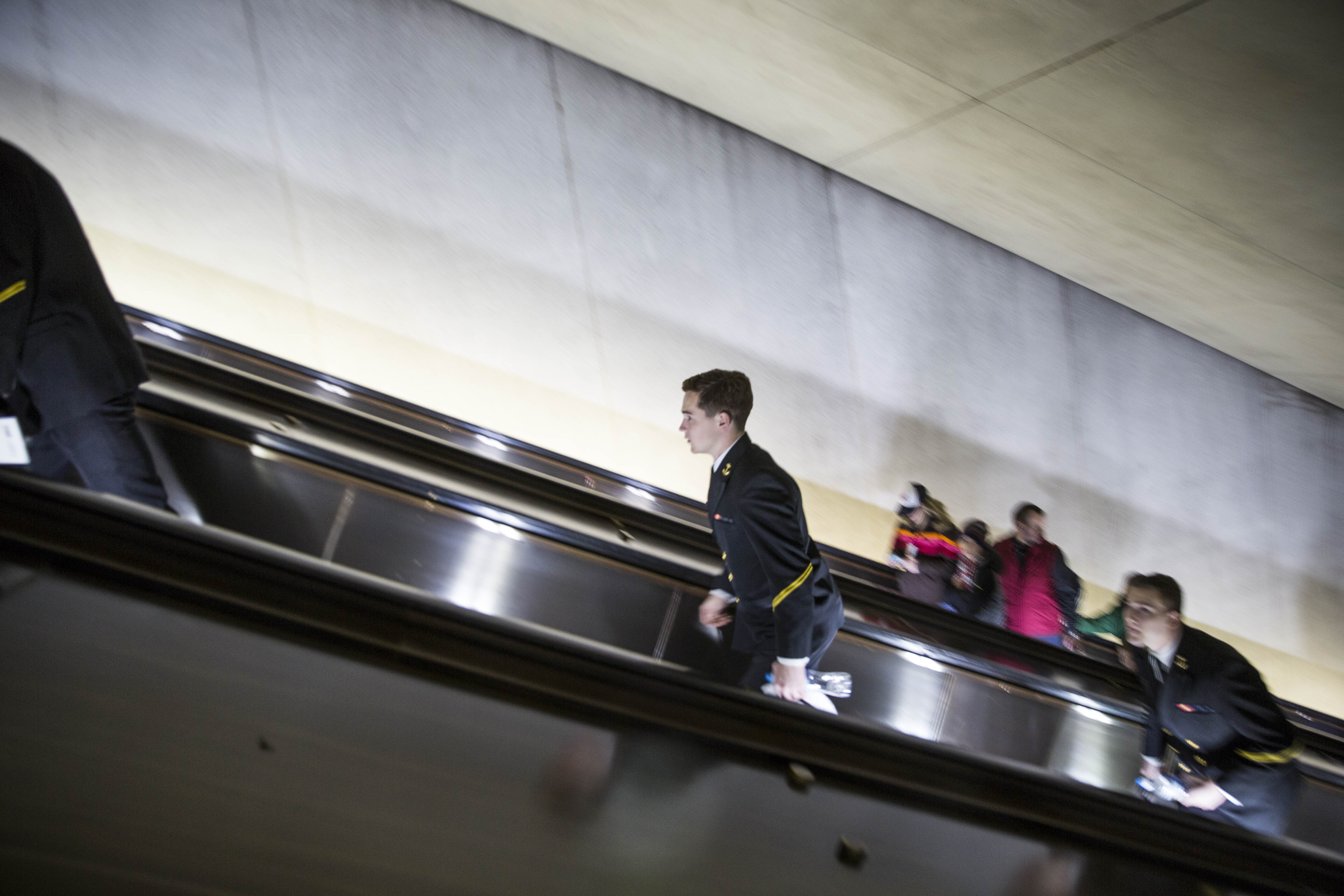A man in uniform ascends from the L'Enfant Plaza Metro station. | ©Amanda Suarez