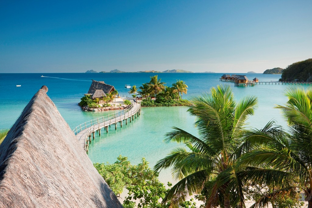 Overwater bungalows at Likuliku Lagoon Resort | Courtesy of Traveloscopy