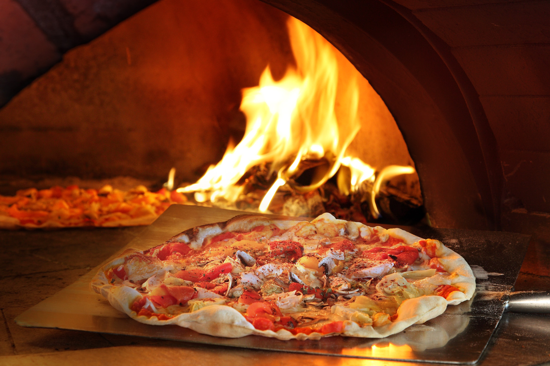 Wood fired thin crust pizza | Courtesy of Trapizza