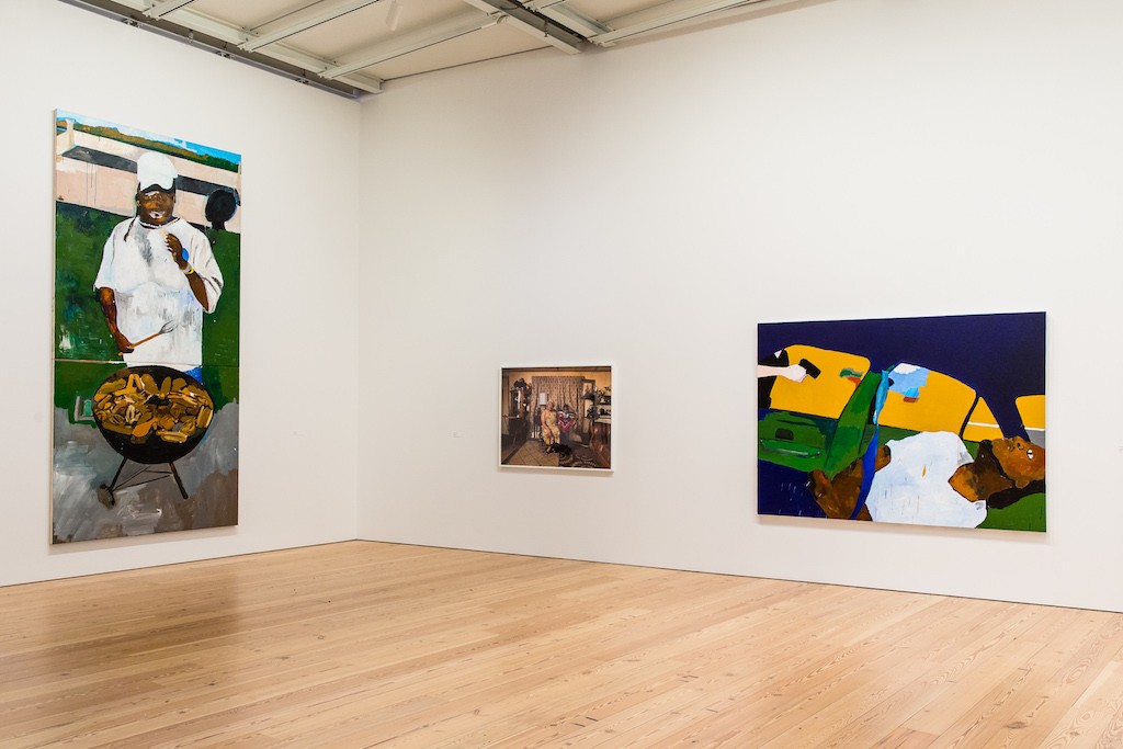 Installation view of Henry Taylor, The 4th, 2012-2017 and THE TIMES THAY AINT A CHANGING, FAST ENOUGH!, 2017. Collection of the artist; courtesy Blum & Poe, Los Angeles/New York/Tokyo. Whitney Biennial 2017, Whitney Museum of American Art, New York, March 13-June 11, 2017. Photograph by Matthew Carasella. Installation view of Deana Lawson, Ring Bearer, 2016. Collection of the artist; courtesy Rhona Hoffman Gallery, Chicago, and Sikkema Jenkins & Co., New York. Whitney Biennial 2017, Whitney Museum of American Art, New York, March 13-June 11, 2017. Photograph by Matthew Carasella.
