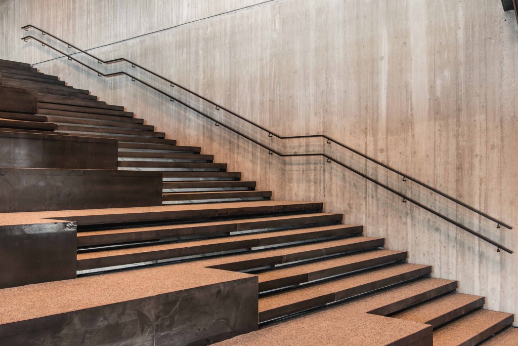 A special wide staircase is divided down the middle to serve both walking and lounging purposes | courtesy of De Krook