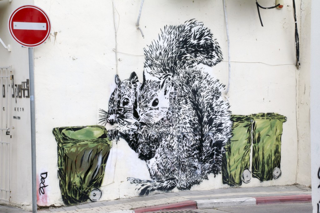 Tel Aviv wished it had squirrels. In the meantime, we make do with graffiti of classic Tel Aviv trash bins (called "Toads") being pushed around by the fuzzy critters | © Ami Zoran