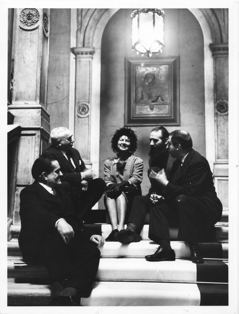 Giuseppe Marchiori, Giovanni Comisso, Peggy Guggenheim, Emilio Vedova and Giuseppe Santomaso on the staircase of the Venice City Hall, on the day Peggy was named Honorary Citizen of Venice; February 5, 1962. Solomon R. Guggenheim Foundation. Photo Archivio CameraphotoEpoche. Gift, Cassa di Risparmio di Venezia, 2005