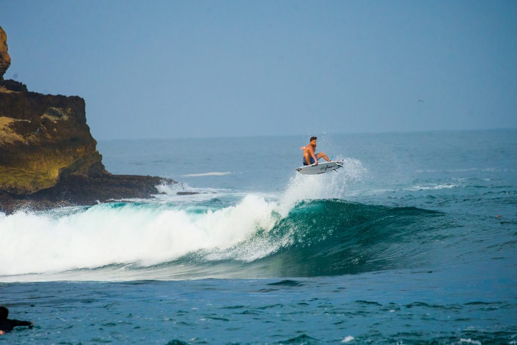 Harry Timson getting air off the coast of Java, Indonesia. | © Luke Forgay/Volcom