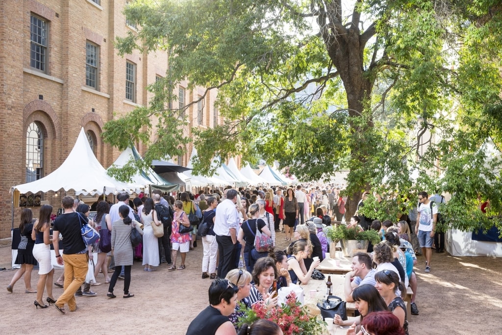 Visitors and stalls at the Christmas Markets, Hyde Park Barracks Museum