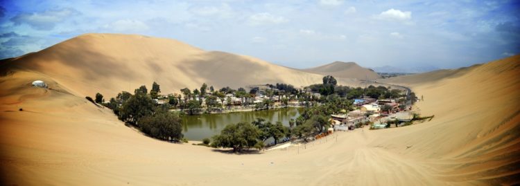 The Huacachina Oasis, in the desert sand dunes near the city of Ica, Peru
