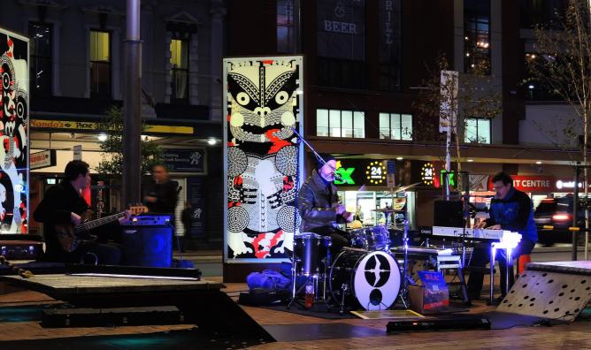 A band perform in Cuba St