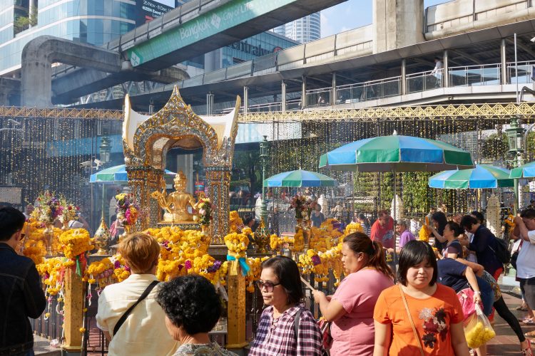 Lay down offerings at the Erawan Shrine