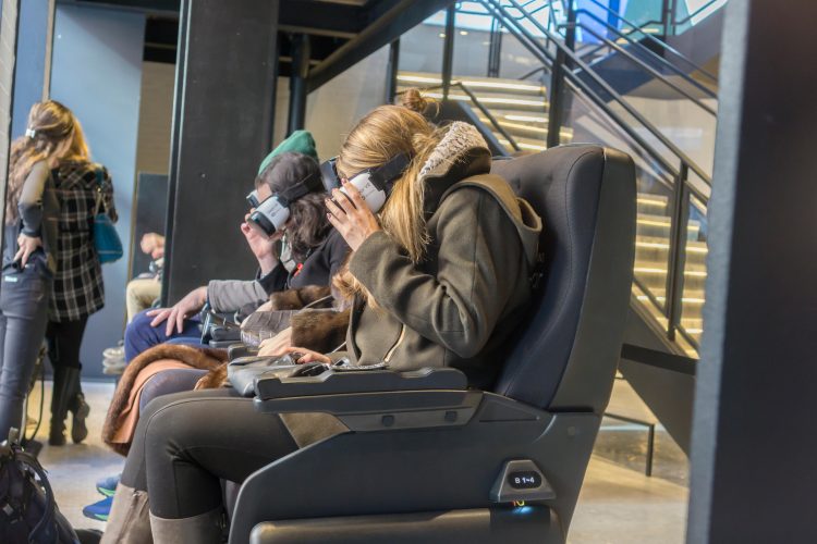 Visitors to the Samsung 837 showroom in the Meatpacking District in New York experience the Samsung VR virtual reality goggles.