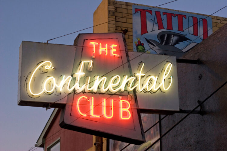 The Continental Club at night with neon sign.