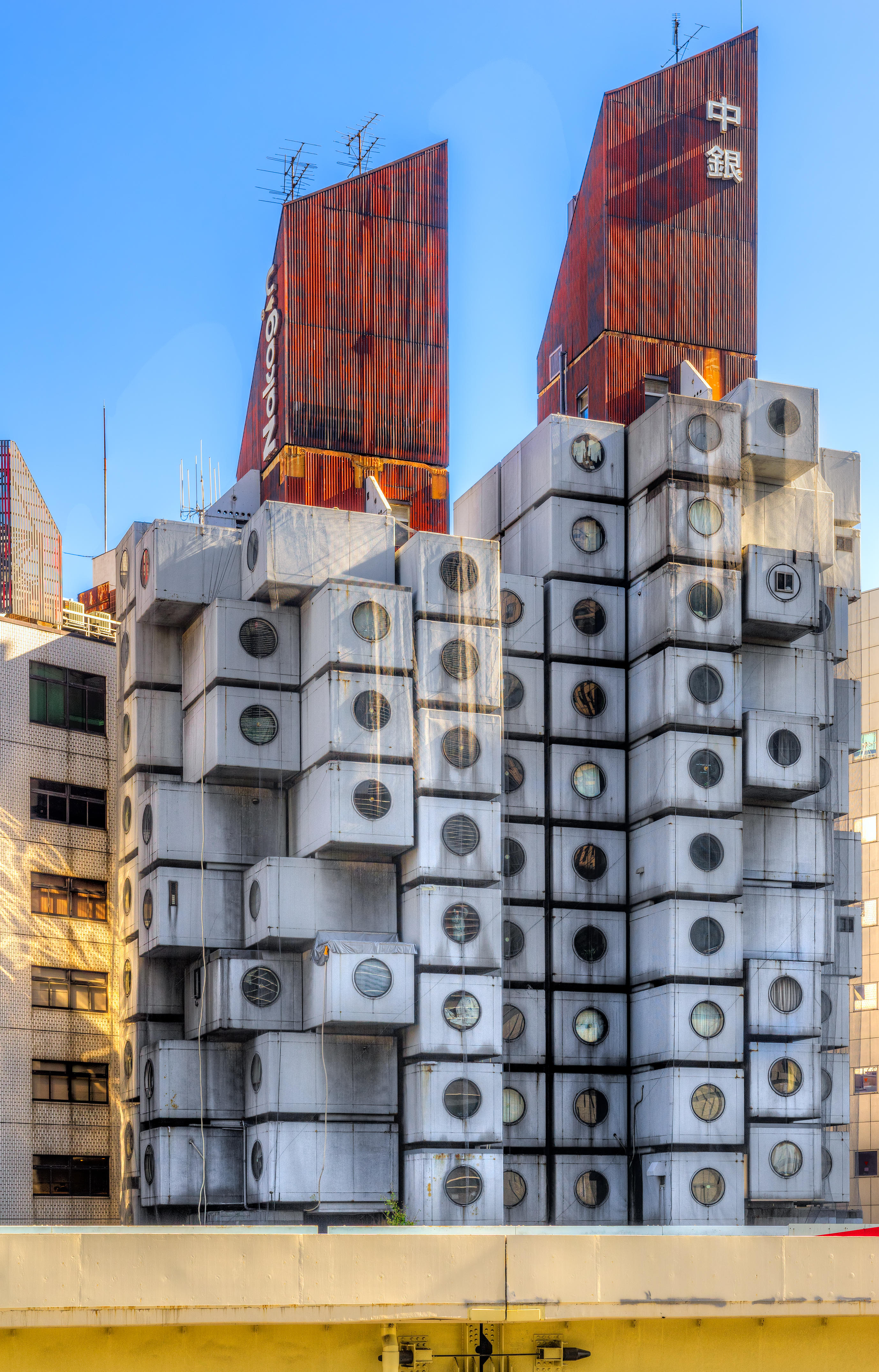 TOKYO, JAPAN - NOVEMBER 12, 2014: Nakagin Capsule Tower in Tokyo, Japan. This residential and office tower designed by architect Kisho Kurokawa was op