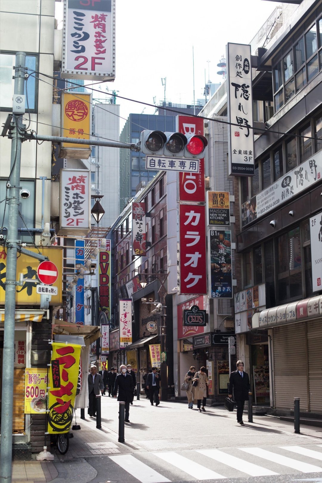 Business people walking to work in the early morning in Tokyo, Japan.
