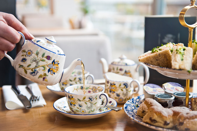 Typical English tea being poured from teapot