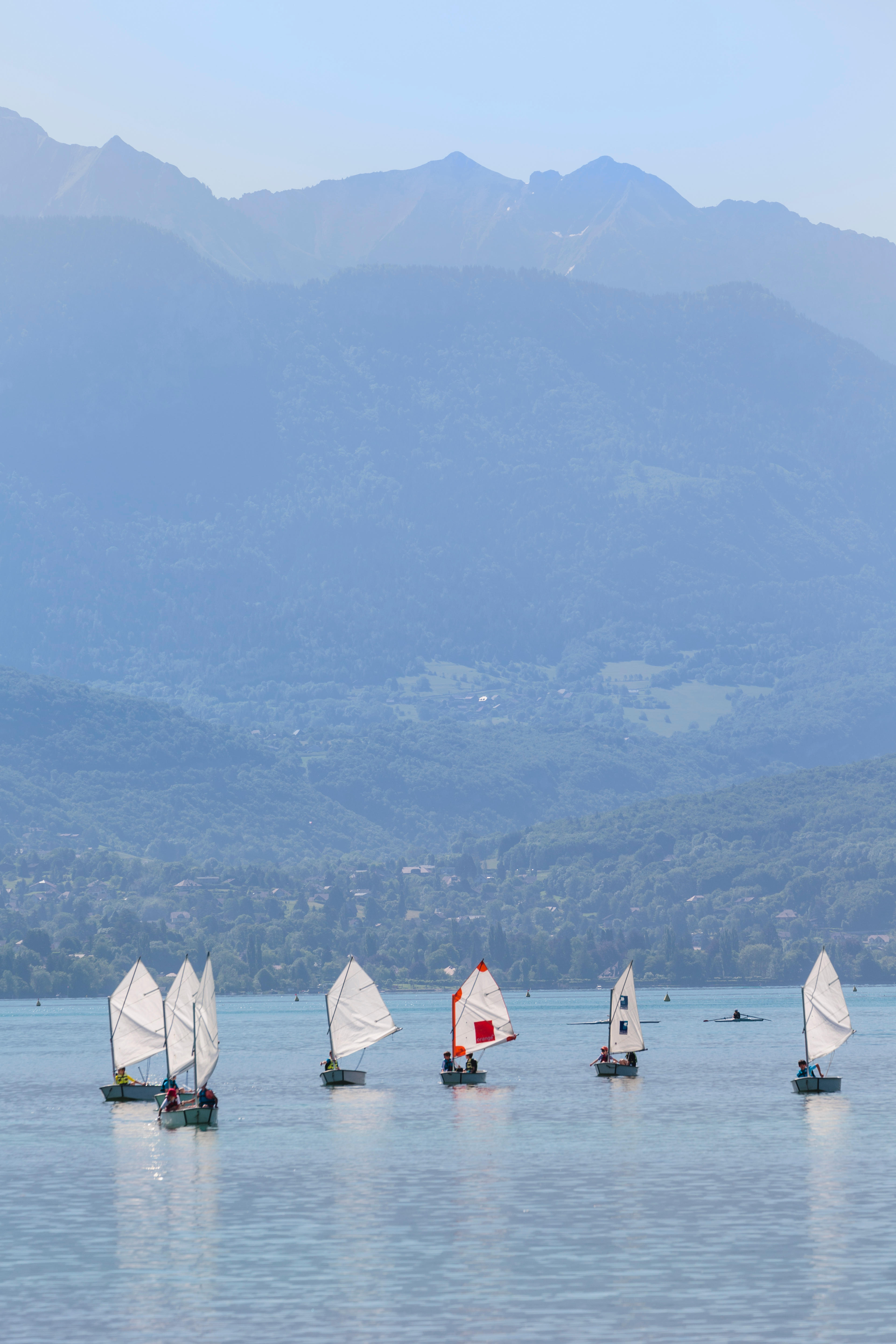 Annecy, Haute-Savoie department, Rhone-Alpes, France. Children sailing dinghies on Lake Annecy.