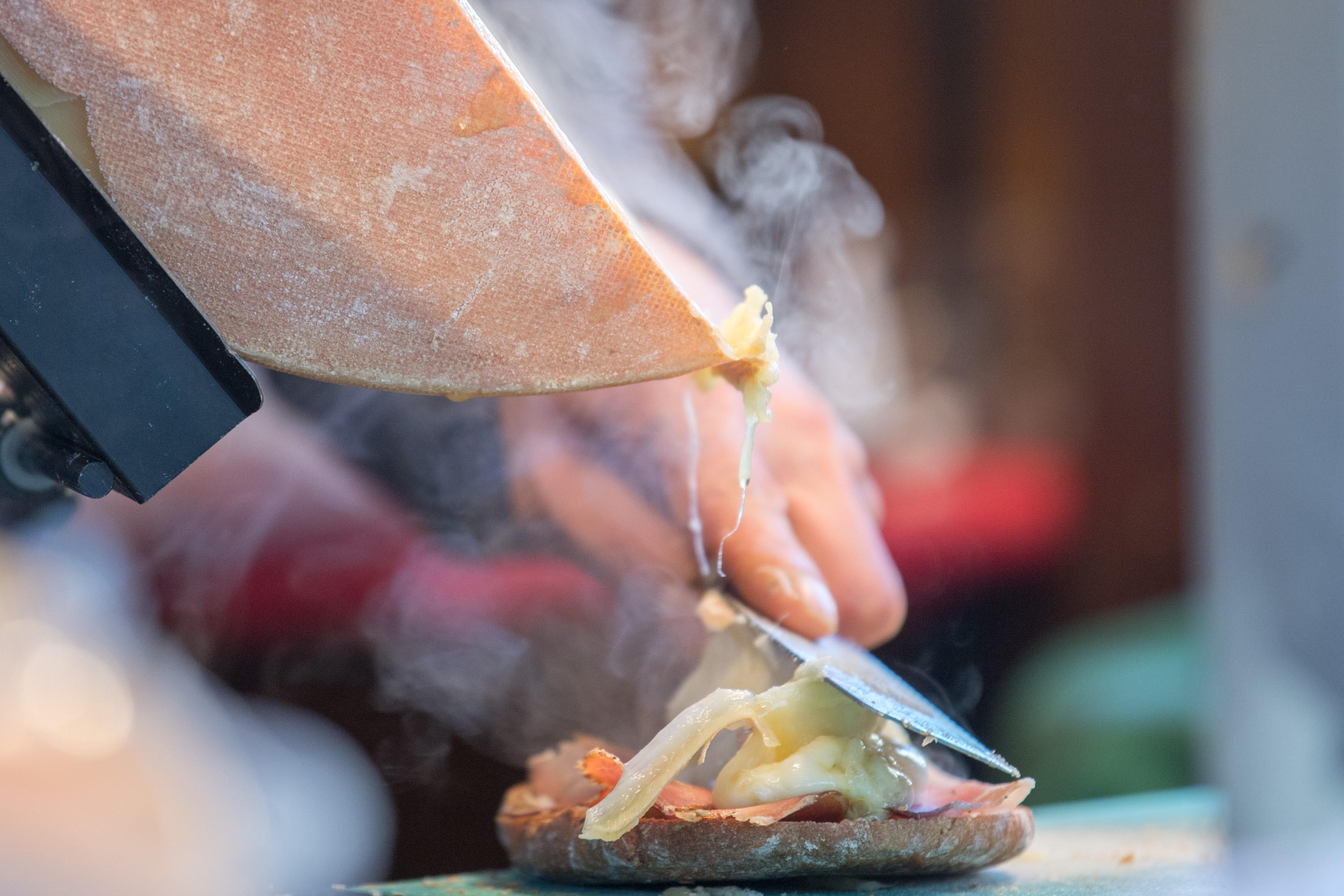 Traditional raclette french cheese detail