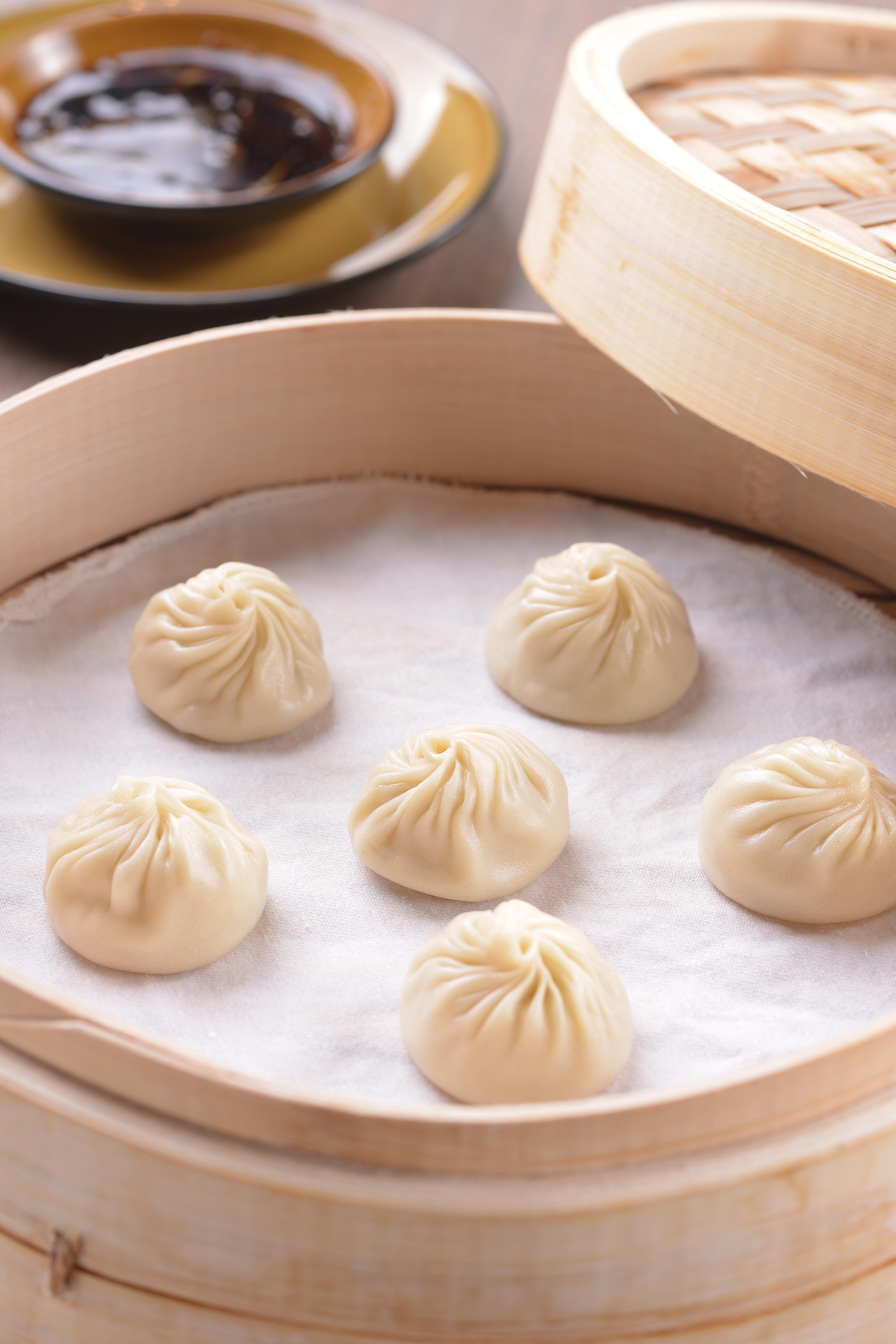 Durian Xiao Long Bao or Chinese dumplings in bamboo tray