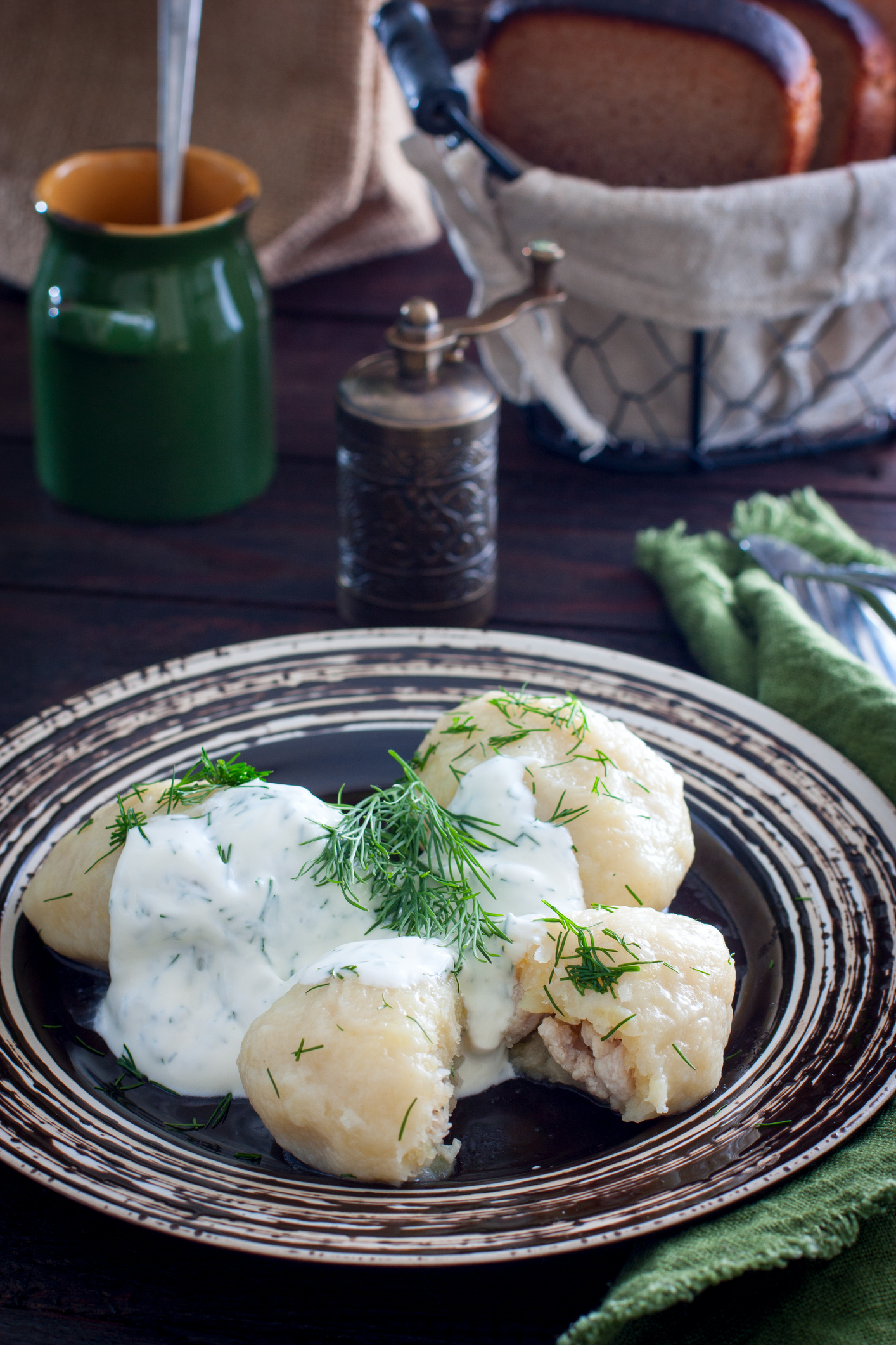 Traditional Lithuanian dish meal cuisine - stuffed meat potato dumpling (Cepelinai,didzkukuliai),most popular Lithuanian national dish, curd, similar to polish