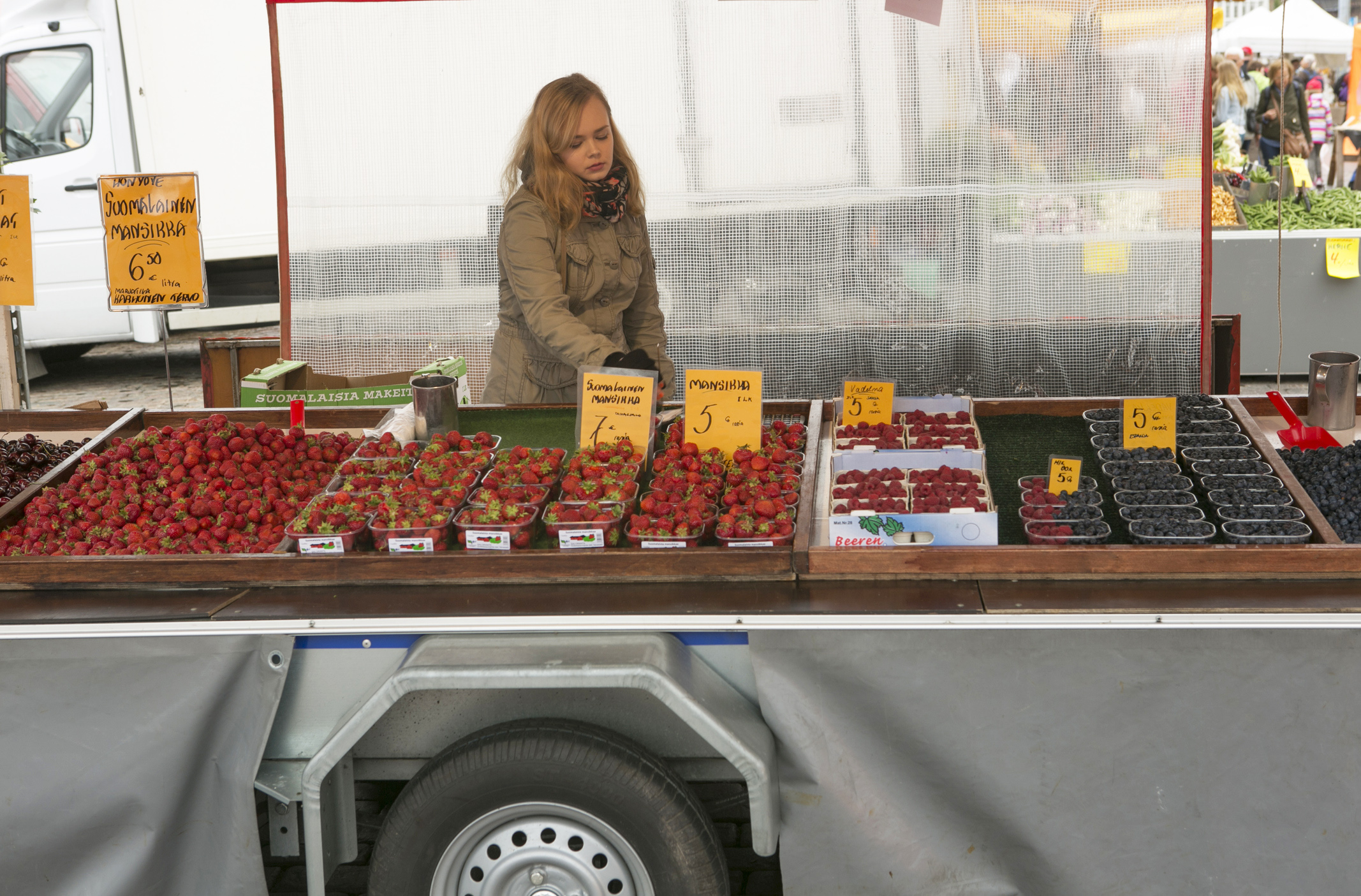 person selling fresh fruit by market square at helsinki finland