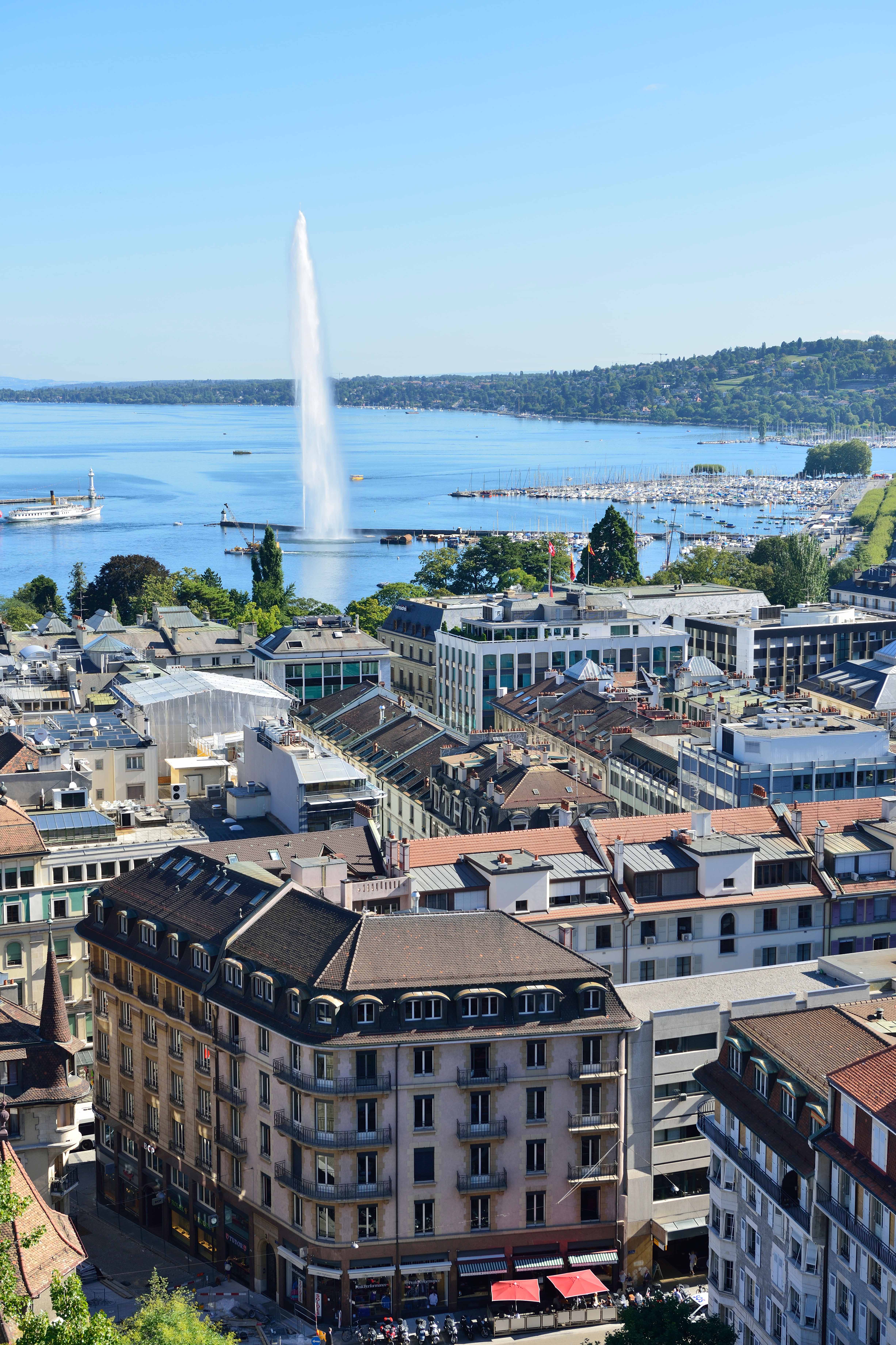 The famous Jet deaux also known as water fountain of the lake of Geneva, Switzerland ( Lac Leman ) with boats and blue sky and water. Image shot 08/2012. Exact date unknown.