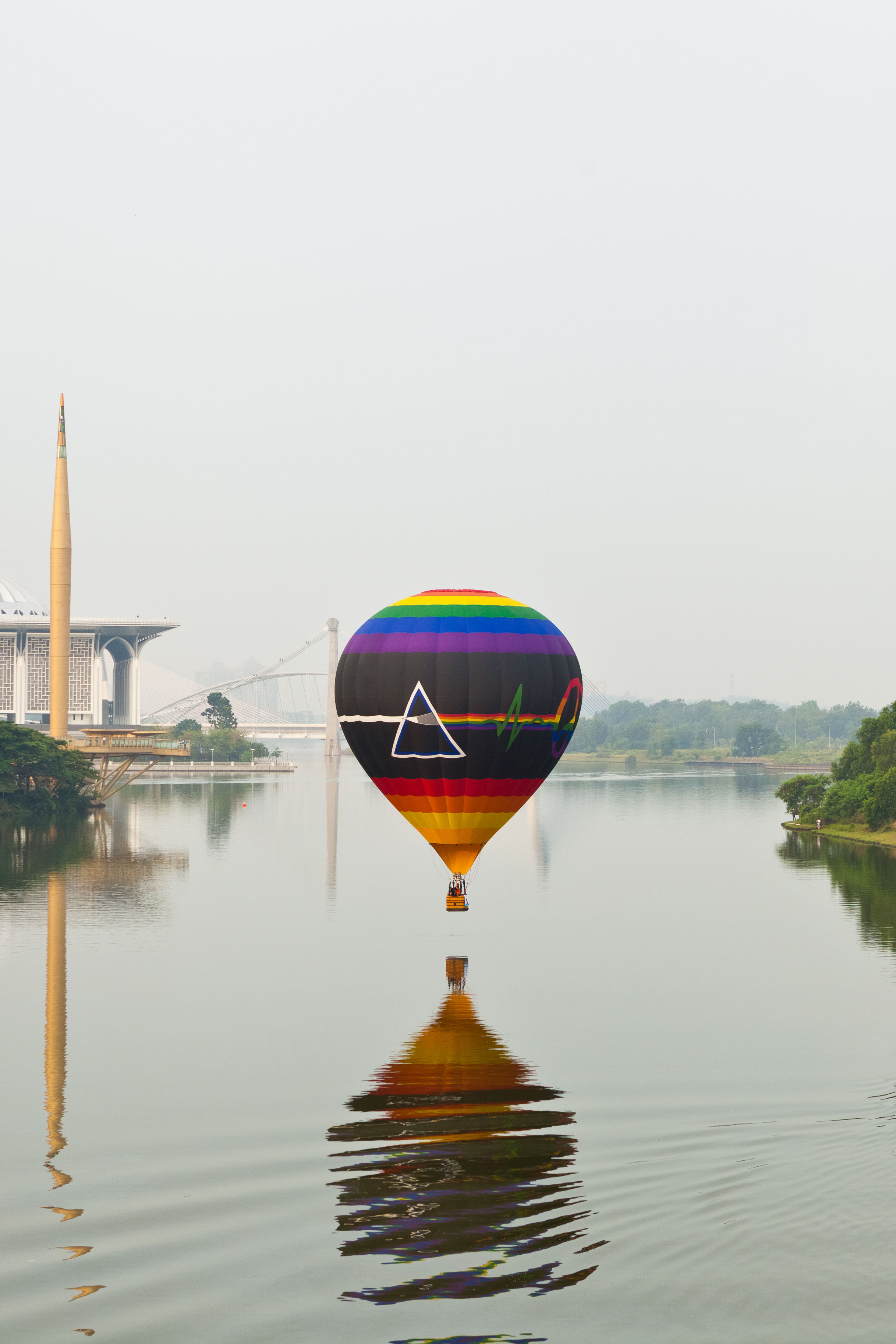 PUTRAJAYA, MALAYSIA - MARCH 2013 - One of the hot air balloon hovers over the river surface on March 2013 at Putrajaya. The annu