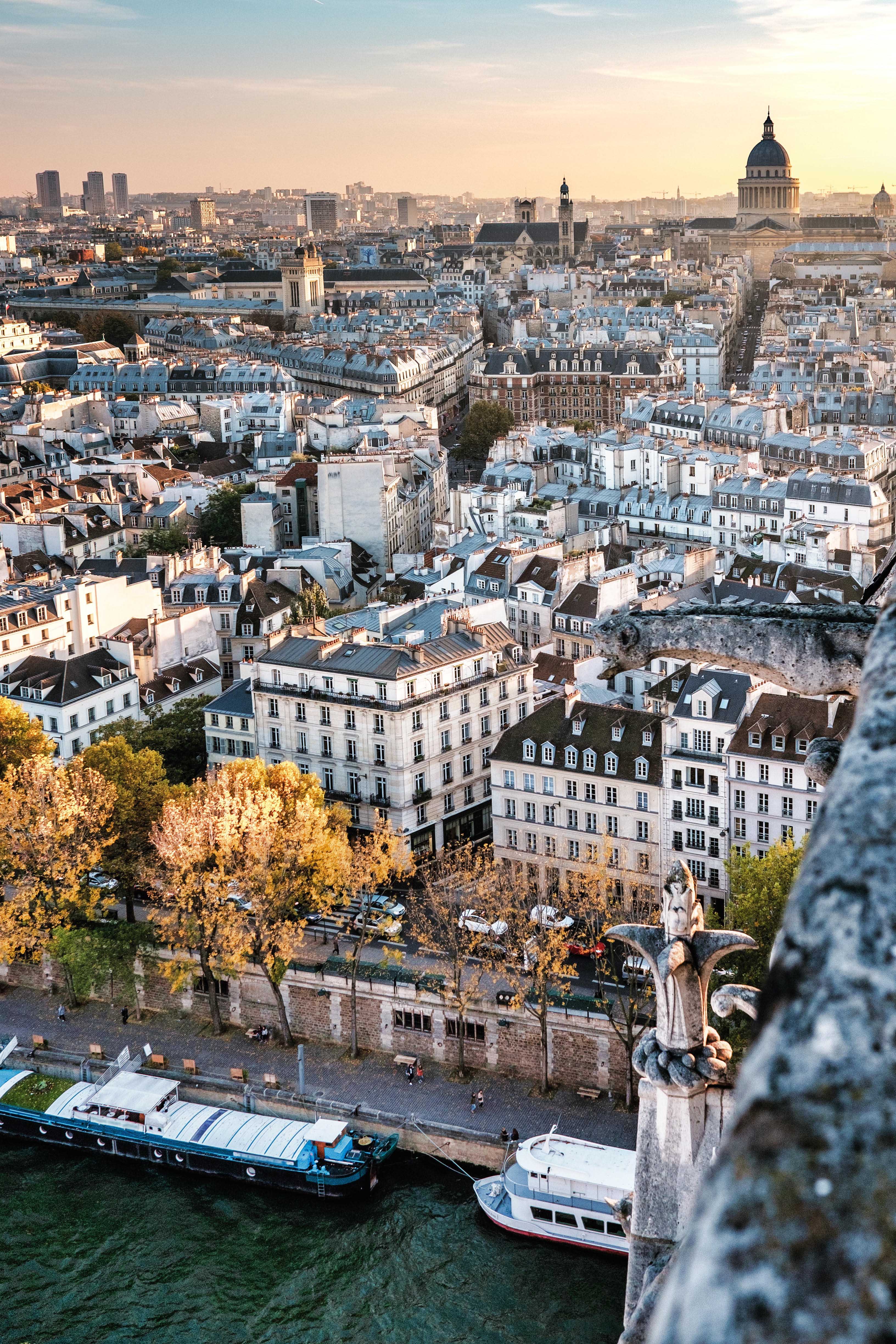 High resolution aerial panorama of Paris, France. The river Seine and autumn colors with blue sky.