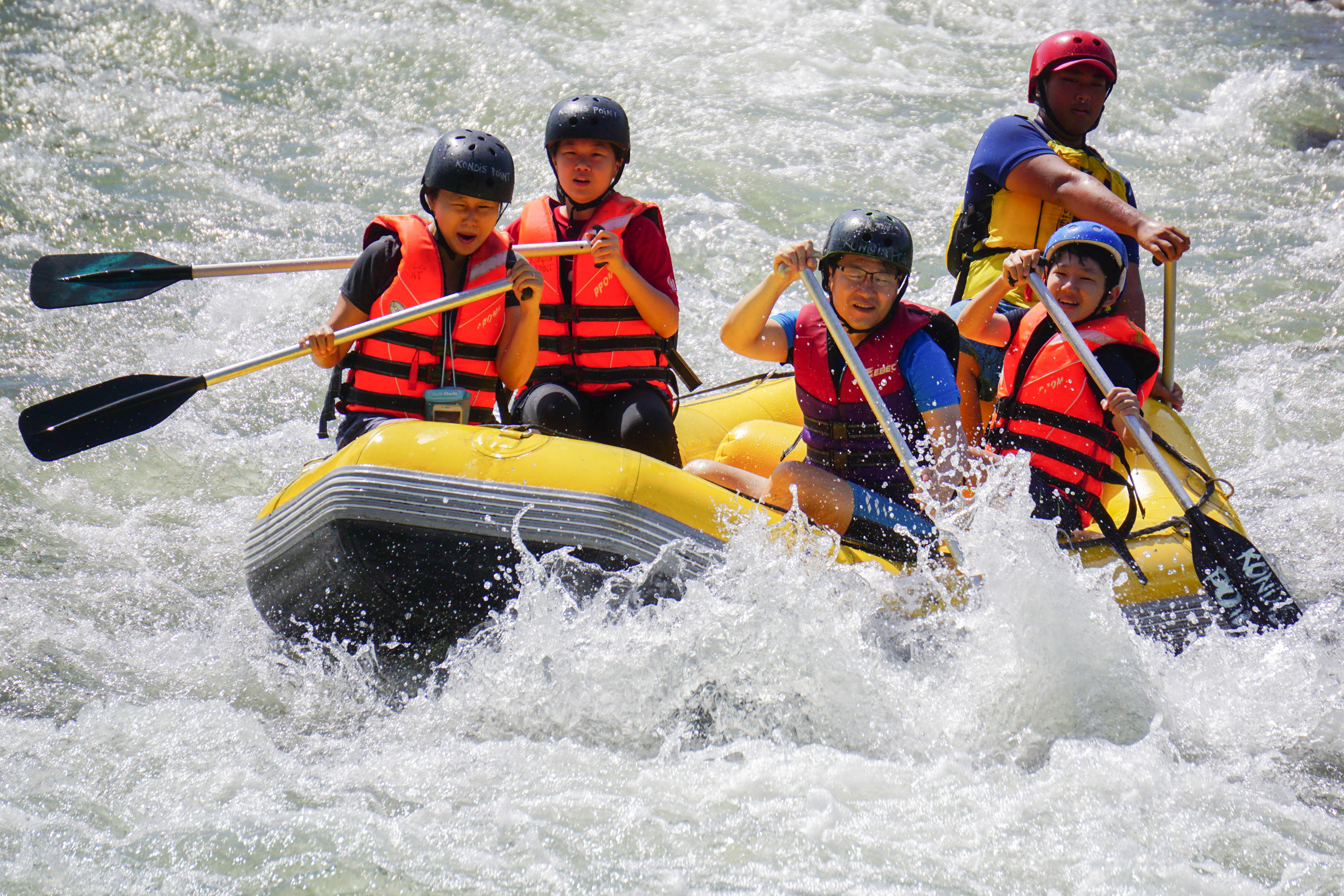 Kiulu Sabah Malaysia - Nov 4, 2018 : Group of adventurer doing white water rafting activity at Kiulu river Sabah Malaysian Borneo on Nov 4, 2018.The r