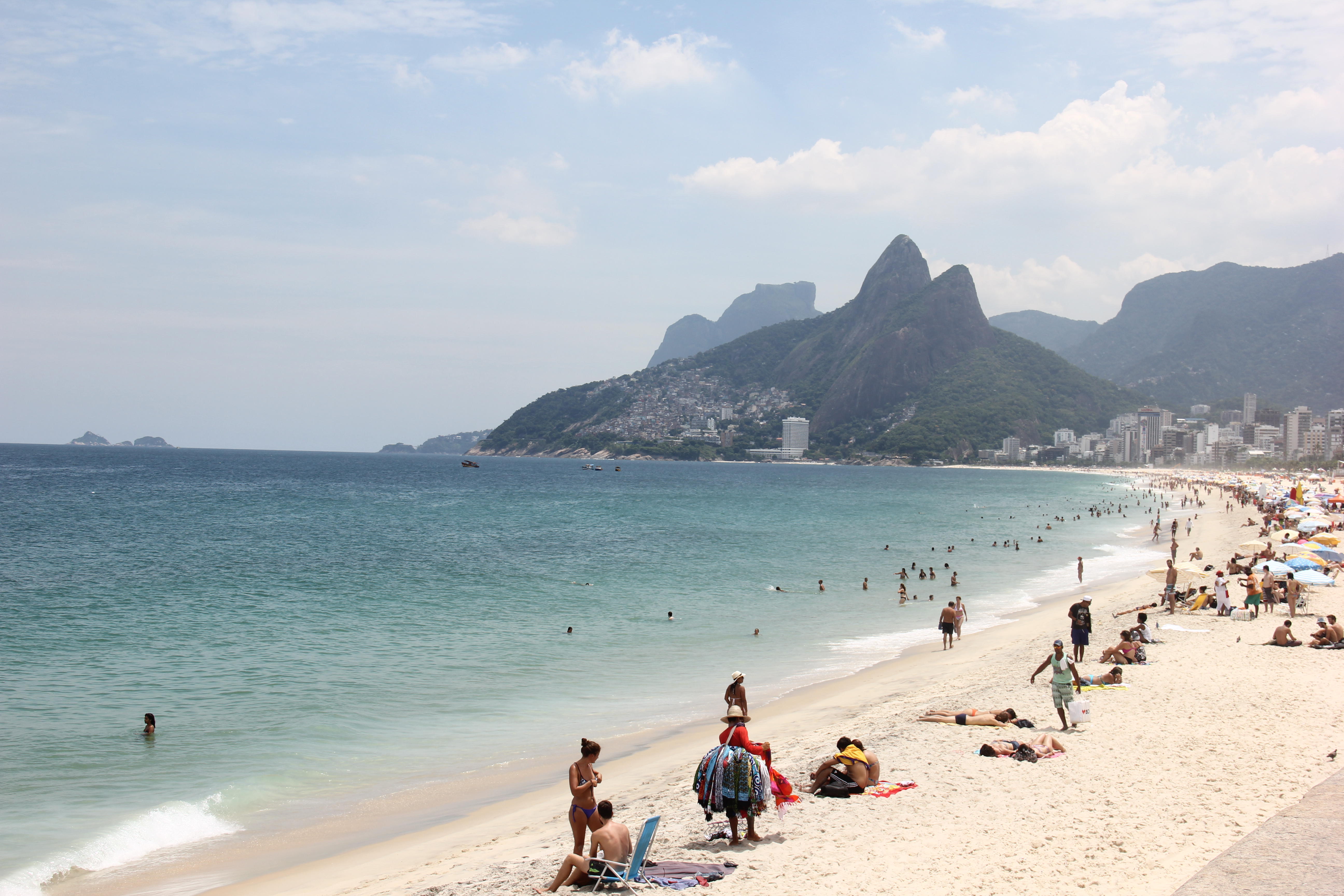 Rio de Janeiro, Brazil, 24 February 2016: With the strong heat, passing the 35 degrees celsius, locals and tourists enjoying the the Southern Rio beaches even during weekdays. View of Ipanema and Leblon beaches that were in the clear and calm waters on th