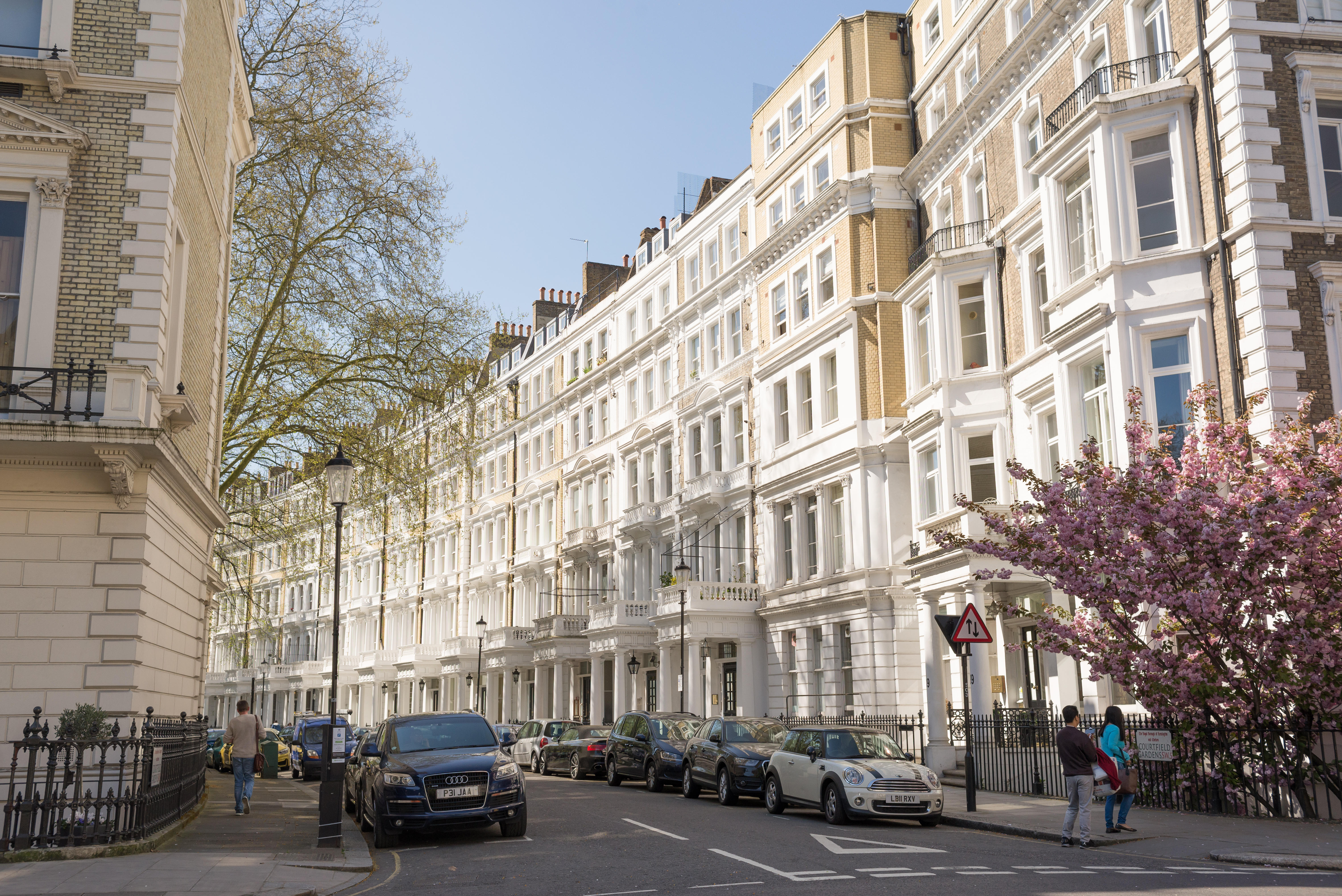 View of street with restored elegant Victorian Edwardian luxury houses in the exclusive area of South Kensington, London, UK