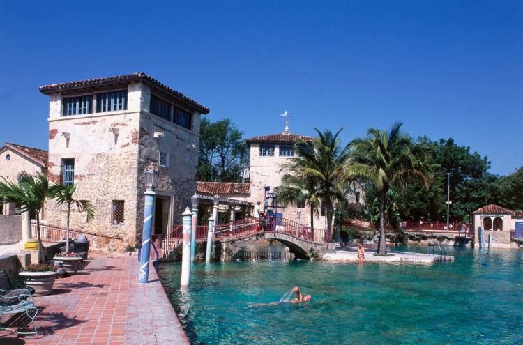 USA, Florida, Miami, Coral Gables, visitor swimming in Venetian Pool